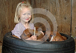 Child with puppies