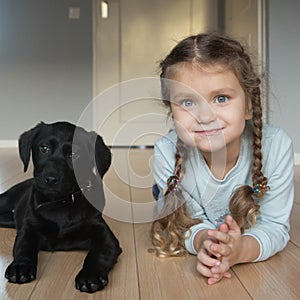 Child and puppy are happy. Animal care concept