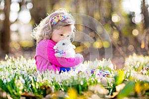 Child with rabbit. Easter bunny. Kids and pets