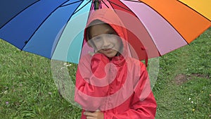 Child in Rain, Kid Playing Outdoor in Park Girl Spinning Umbrella on Raining Day