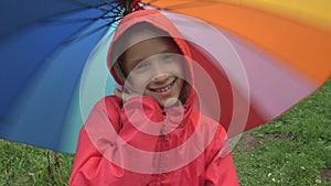 Child in Rain, Kid Playing Outdoor in Park Girl Spinning Umbrella on Raining Day