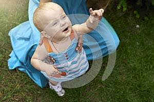 Child reaches his hand up