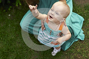 Child reaches his hand up