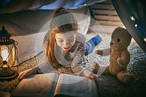 Child is reading a book