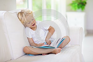 Child reading book. Kids read books