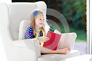 Child reading book. Kids read books