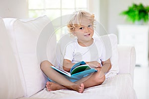 Child reading book. Kids read books