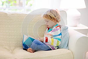 Child reading book. Kids read books