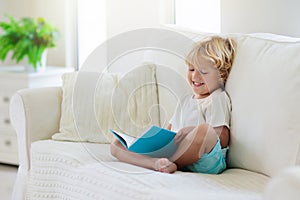 Child reading book. Kids read books