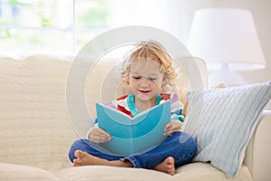 Child reading book. Kids read books