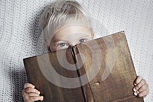 Child reading old book