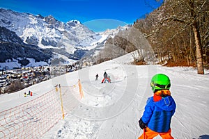 Child ready for skiing famous Ski resort in Swiss Alps.