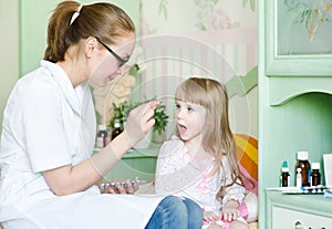 Child receiving pill