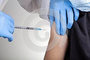 A child is receiving a vaccine shot