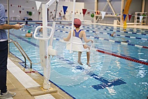 Child rehabilitation session in the swimming pool