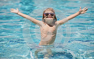 Child relax in summer swimming pool. Summertime and swimming activities for children on the pool.