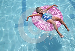 Child relaxing at the pool