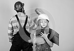 Child renovation room. Family remodeling house. Little fathers helper. Father bearded man and daughter hard hat helmet