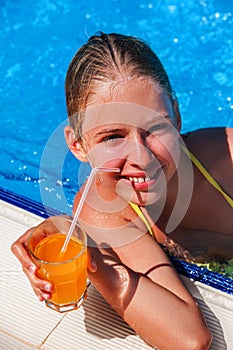 Child resting in a pool.