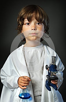 Child with retort and microscope