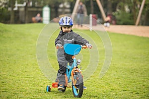 Child rides bike photo