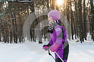 Child rides on skis. forest in winter winter ski child