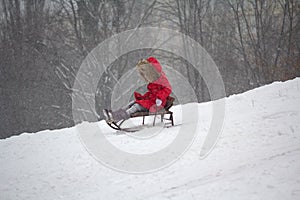 Child rides a sled