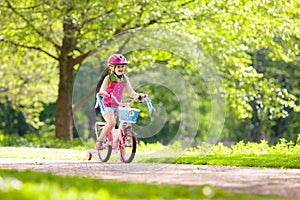 Child riding bike. Kid on bicycle