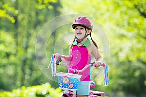 Child riding bike. Kid on bicycle.