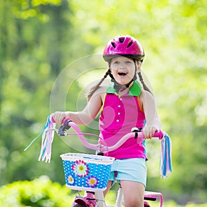 Child riding bike. Kid on bicycle.