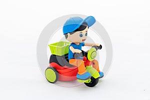 Child riding cycle toy for kids on white background