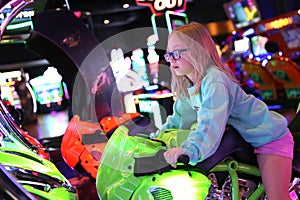 Child Riding Motorcycle Video Game Ride at Arcade