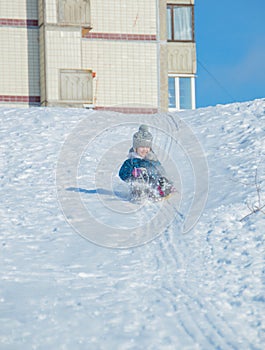 A child riding a roller coaster at ledyankah