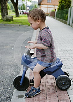 Child riding toy bike