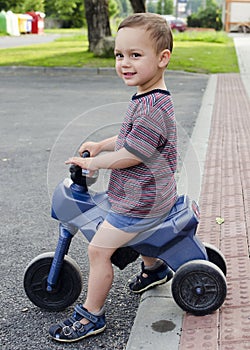 Child riding toy bike