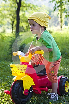 Child riding tricycle