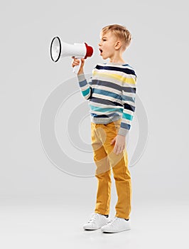 Little boy speaking to megaphone photo
