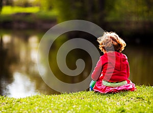 Child on the riverside photo