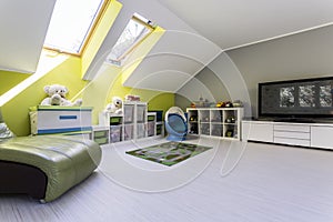 Child room at the attic with TV set