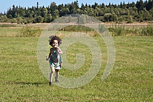 Child running across field