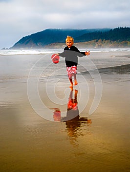 Child Running on Beach at Low Tide