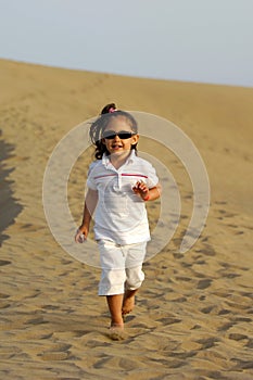 Child running in desert