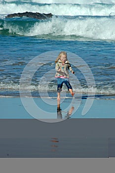 Child running in sea