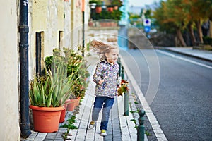 Child running on street of beautiful village Hondarribia in Basque Country, Spain