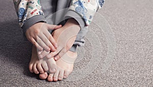 Child`s bare feet. Hands. Heel and foot. Toes and toes