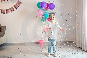 Child's Birthday Celebration With Balloons And Confetti.