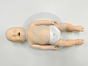 Child`s doll for CPR training and child`s heart massage first aid