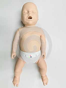 Child`s doll for CPR training and child`s heart massage first aid