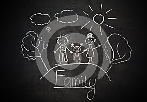 Child's drawing with chalk on school blackboard happy family