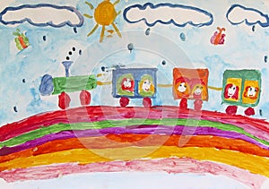 Child`s drawing of merry train traveling along rainbow in rain. Children`s art